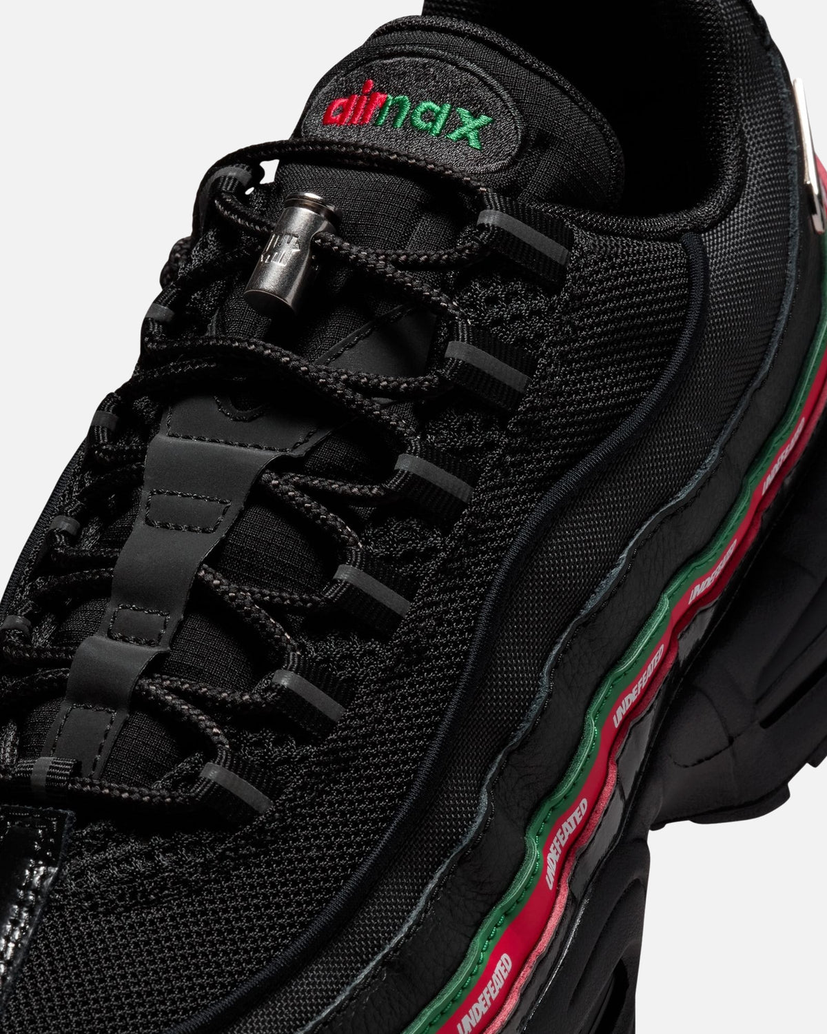 UNDEFEATED x Nike Air Max 95 Sneakers – Black with Red & Green Accents